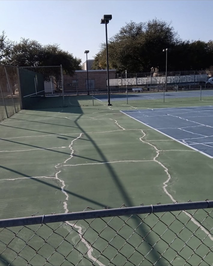 Cracked sport court before repair in Dallas Texas